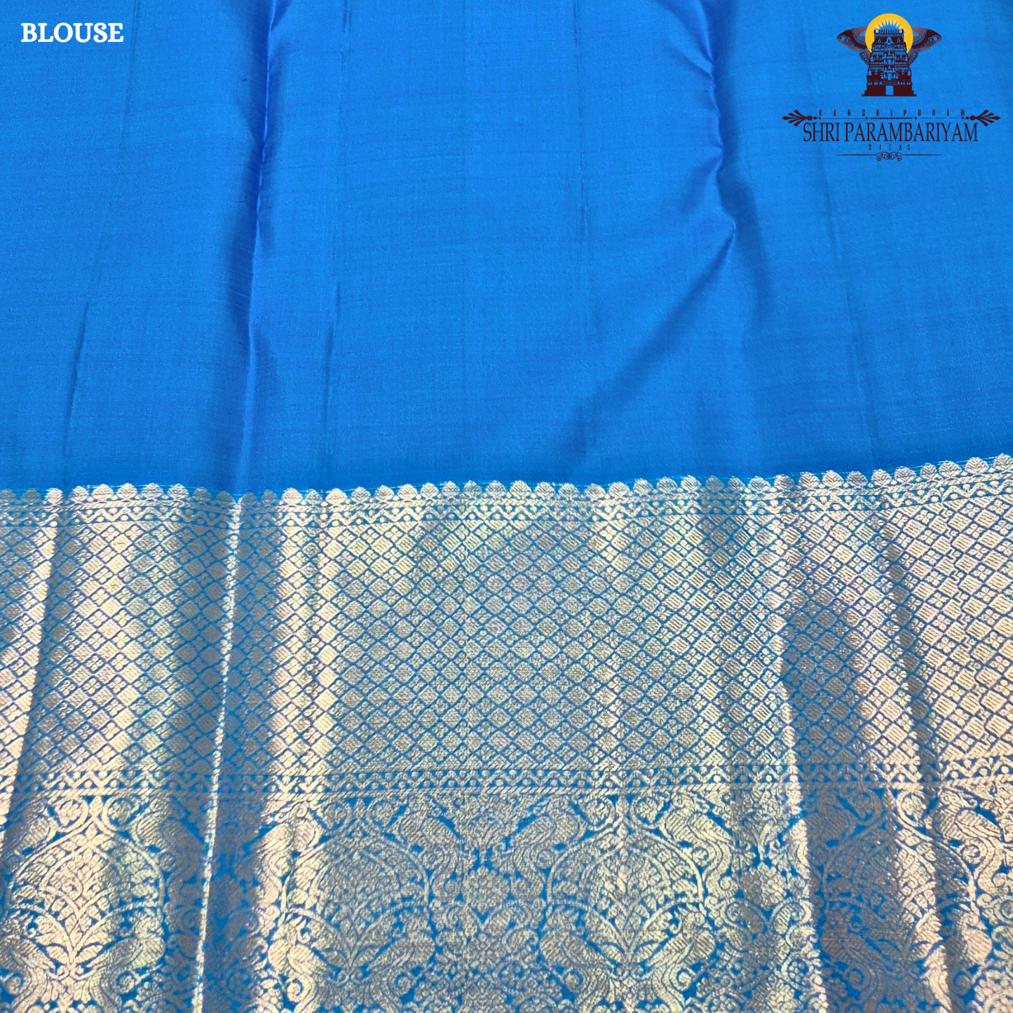 A vibrant royal blue with a smooth, luminous silk finish Saree