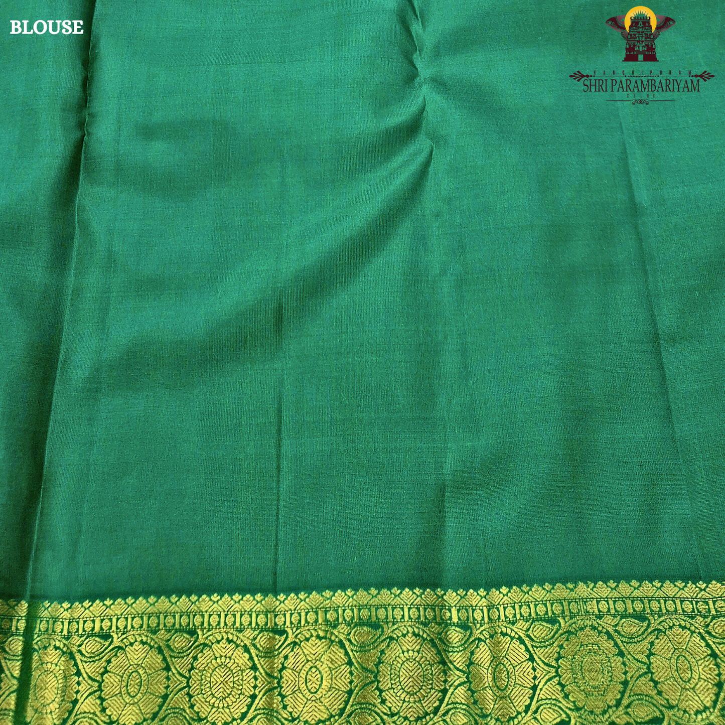 Soft peach-beige body paired with a rich parrot green 2-inch border and subtle gold zari detailing Saree