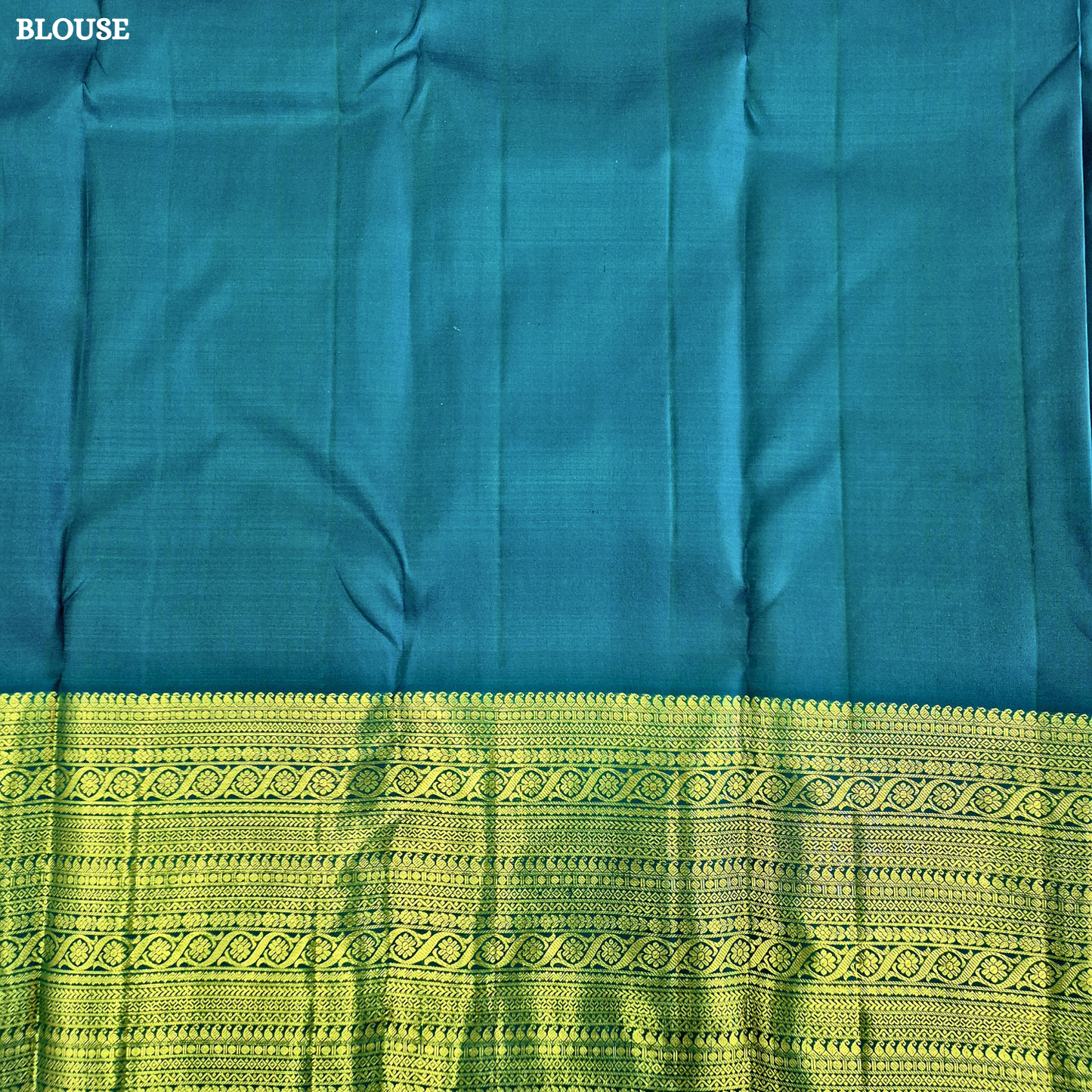 A stunning royal teal blue body adorned with delicate gold zari Saree