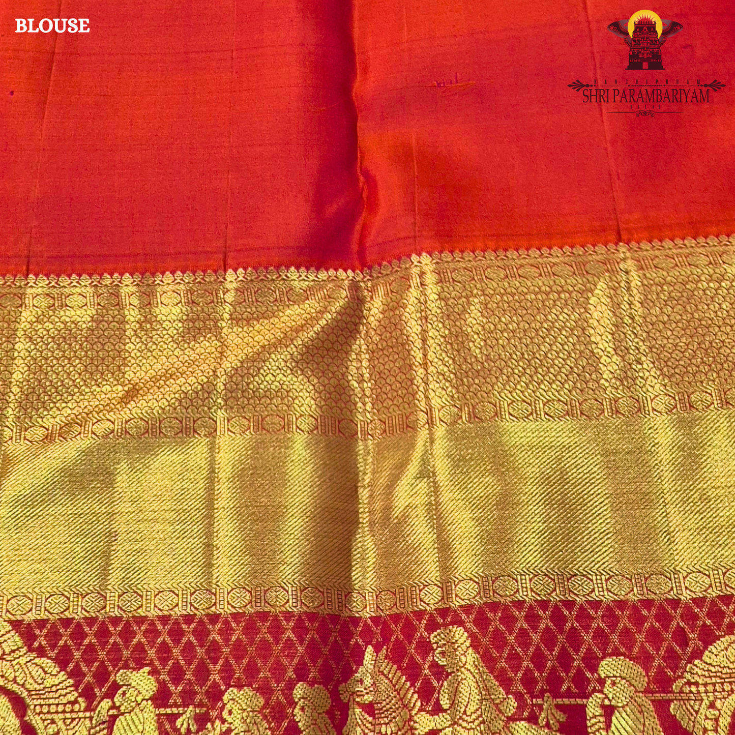 A vibrant bridal red color paired with rich gold zari weaving Saree