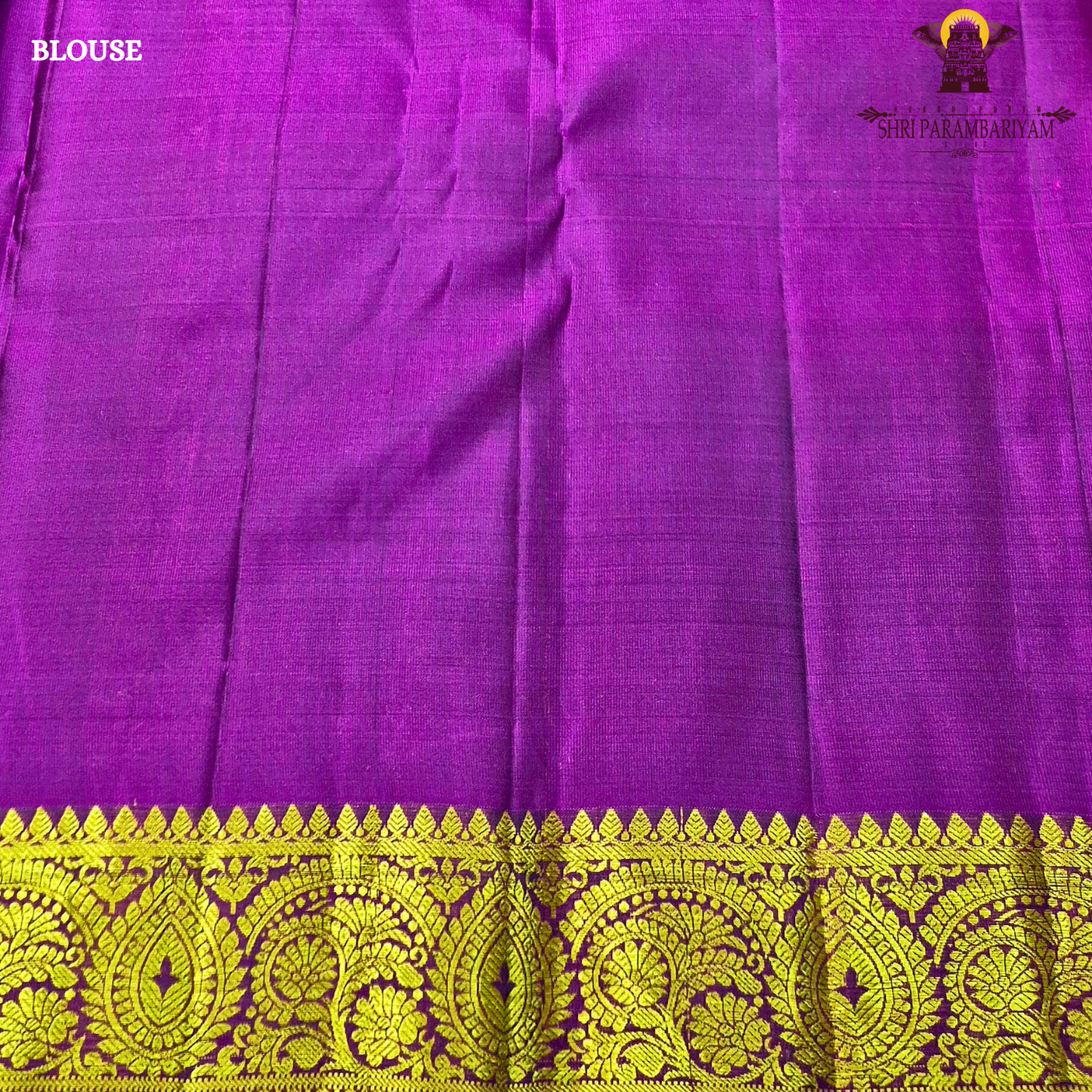 A rich royal blue body beautifully contrasted with a vibrant magenta Saree
