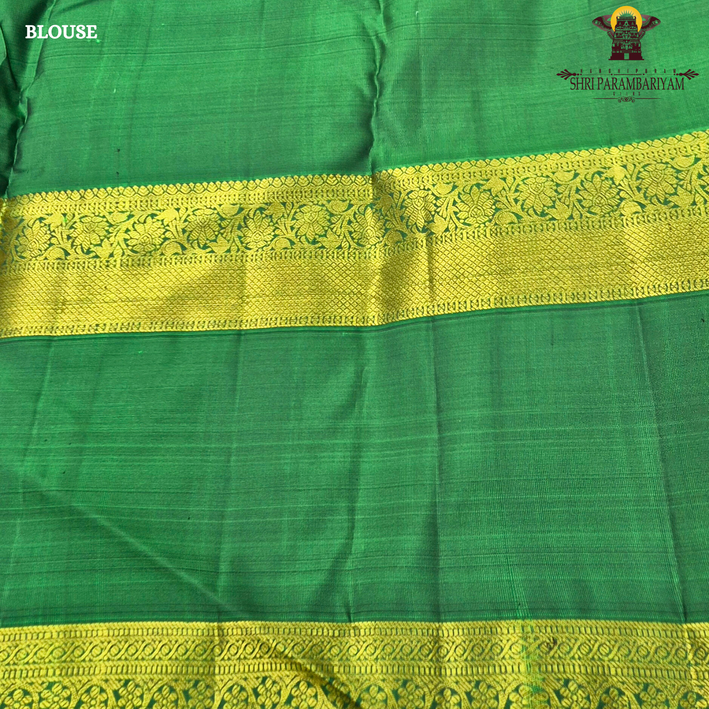 A rich royal purple body beautifully complemented by a vibrant parrot green contrast border Saree