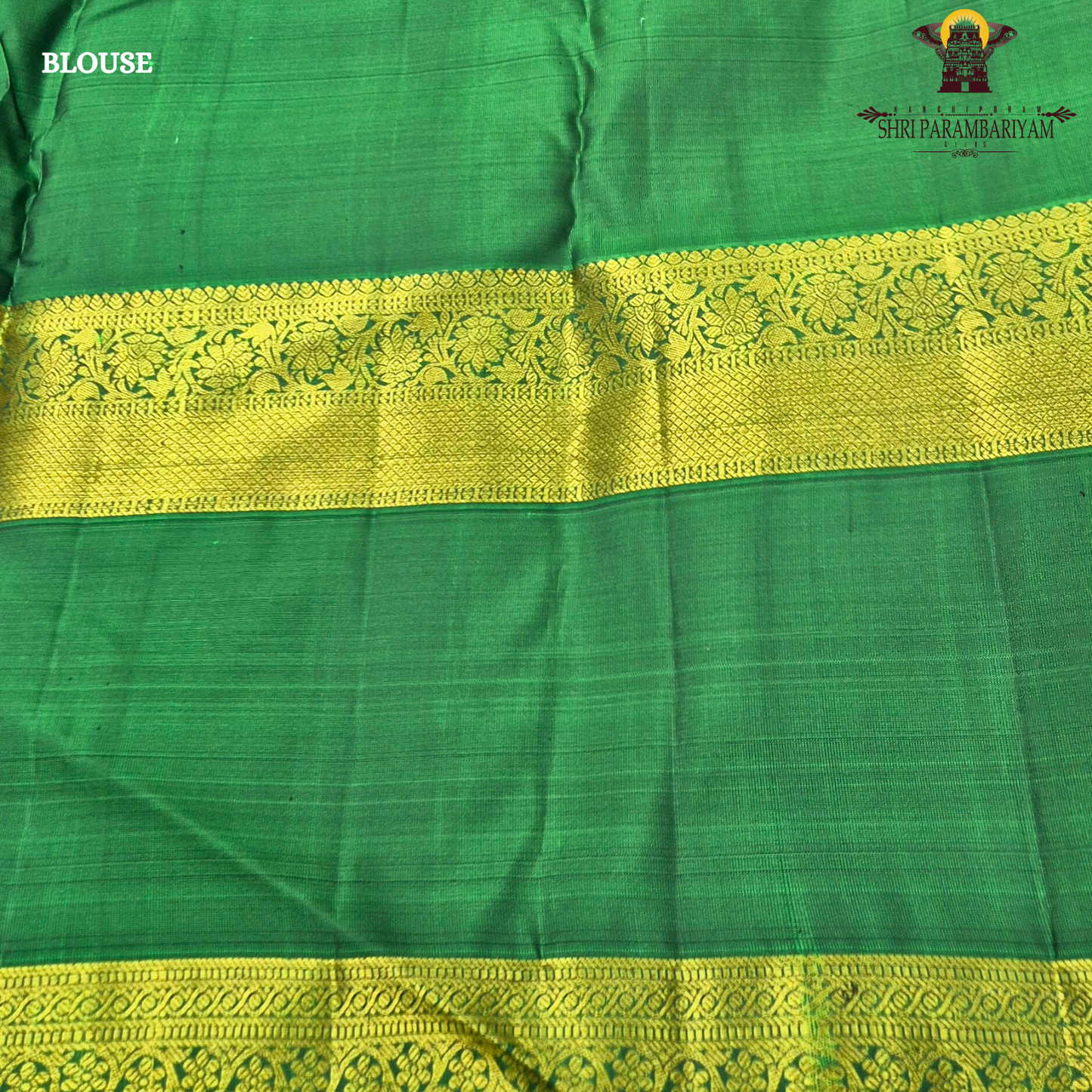 A rich royal purple body beautifully complemented by a vibrant parrot green contrast Saree