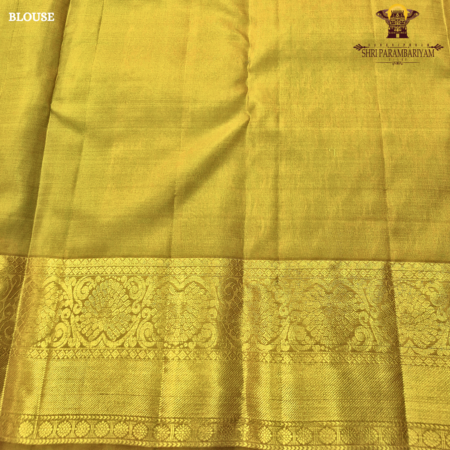 Rich teal green (peacock green tone) with a contrast gold zari border featuring a parrot green shade Saree