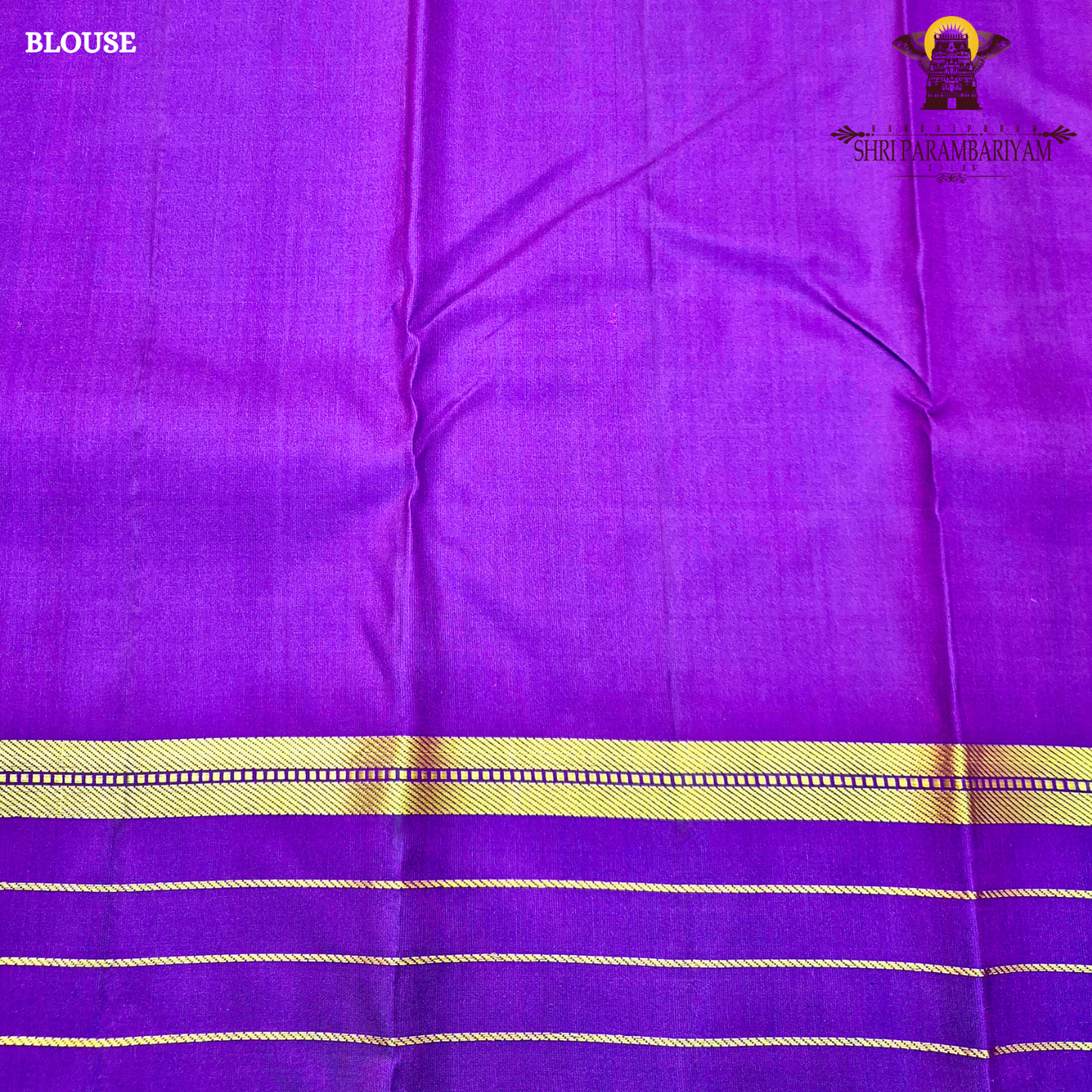 A rich mustard orange body paired beautifully with a deep royal purple pallu and border Saree