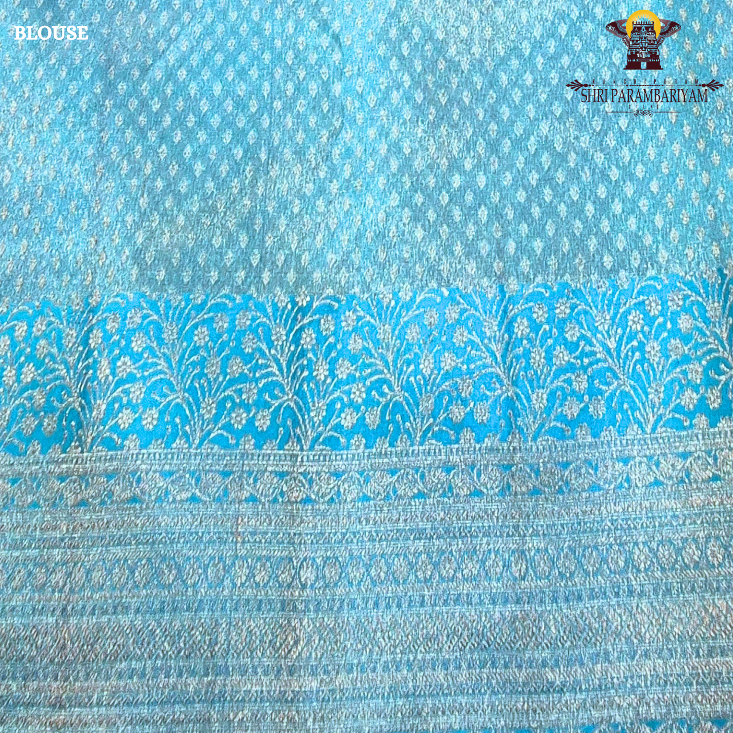 A beautiful combination of lavender (light purple) body with a contrasting turquoise blue (peacock blue) Saree