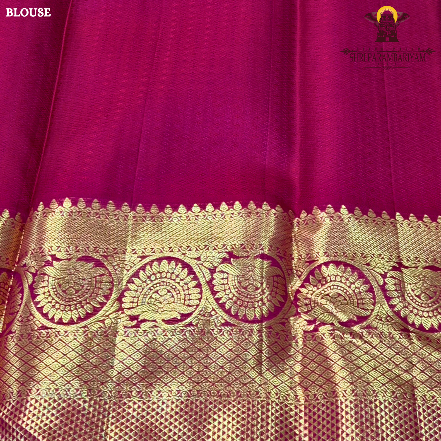 A rich and regal deep magenta / rani pink base adorned with opulent antique gold zari work Saree