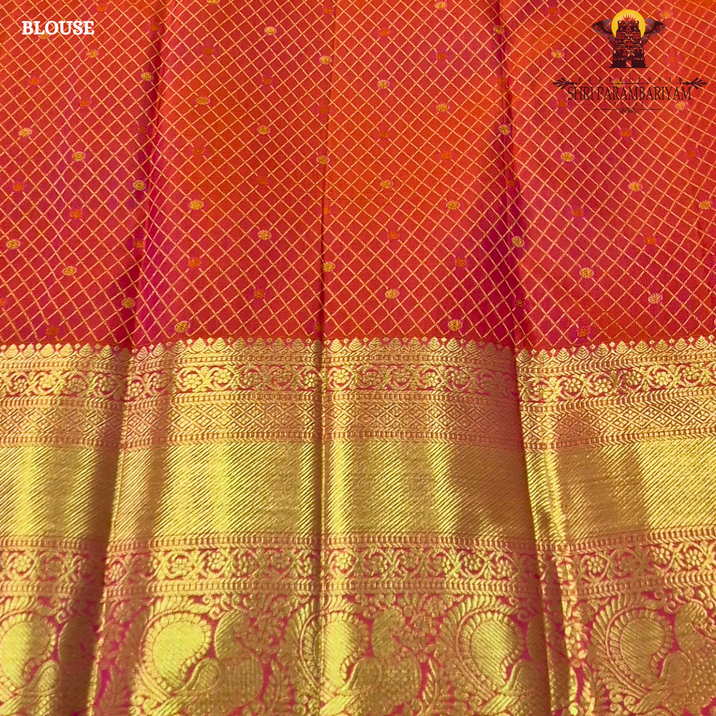 A vibrant reddish orange and pink combination with a radiant gold zari Saree