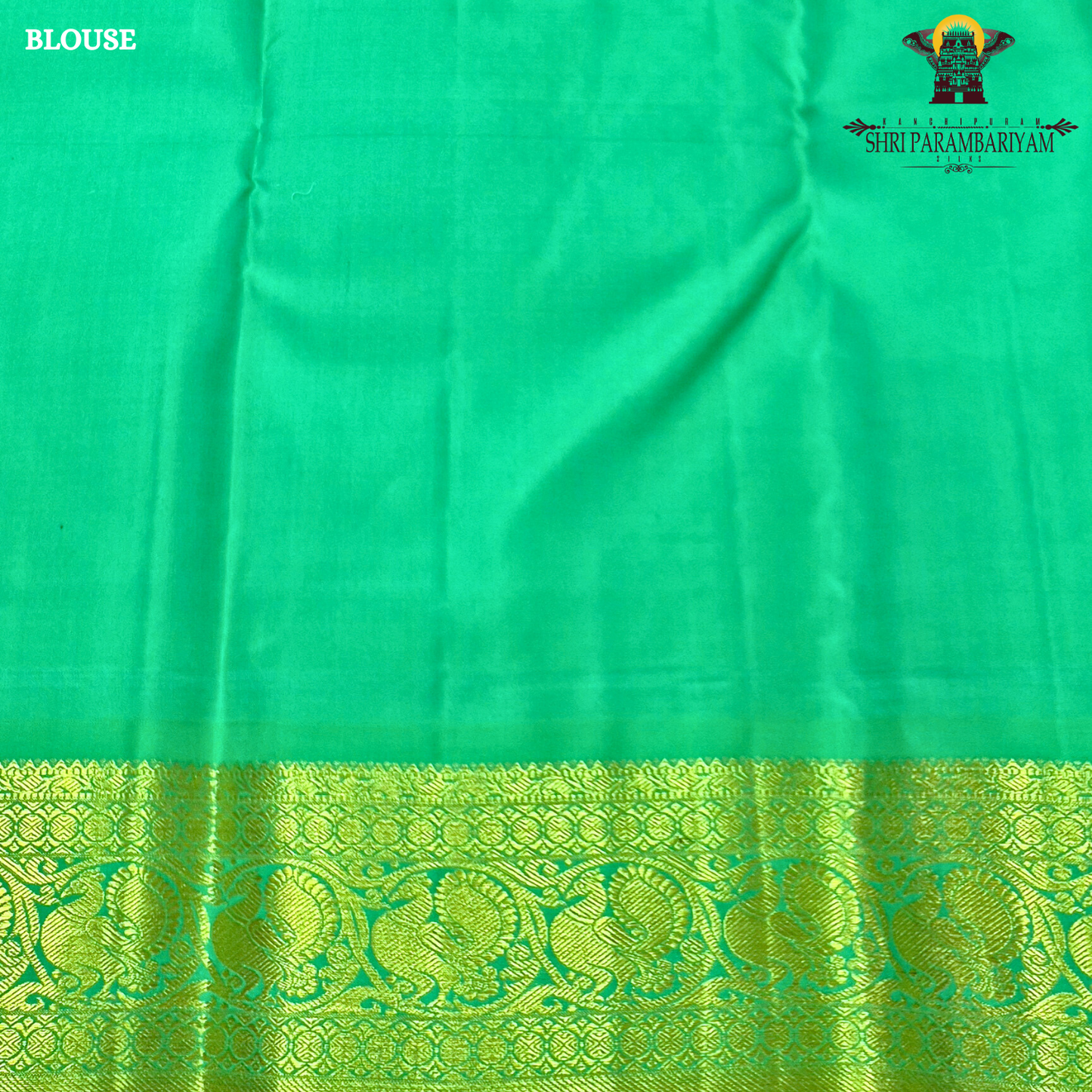 A rich royal purple body paired with a parrot green border highlighted Saree