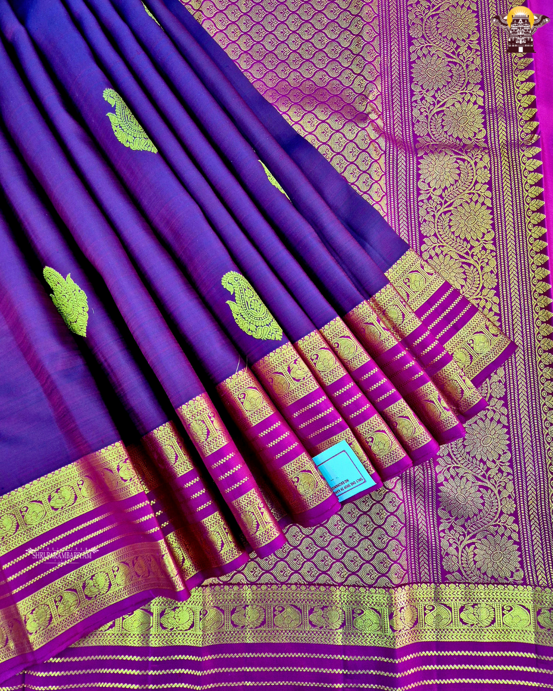 A rich dual-tone deep wine purple with magenta undertones Saree