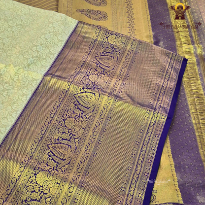 A regal combination of champagne gold and deep royal blue Saree