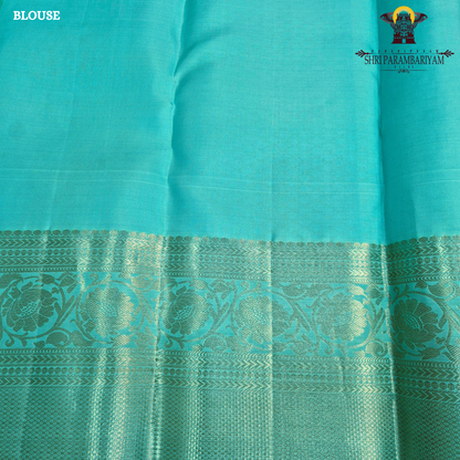 Elegant sea green / aqua blue shade with silver zari work and a subtle peach Saree