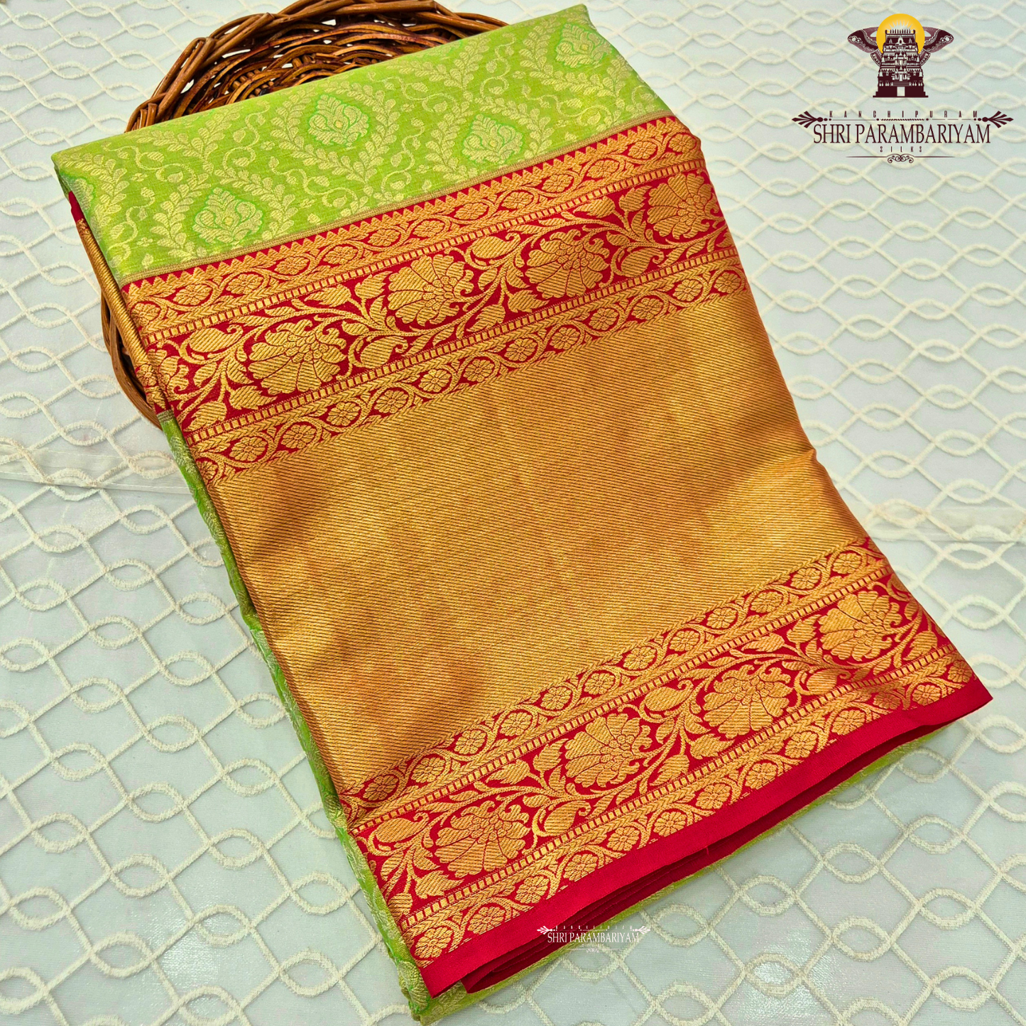 A vibrant combination of parrot green and rich gold Saree