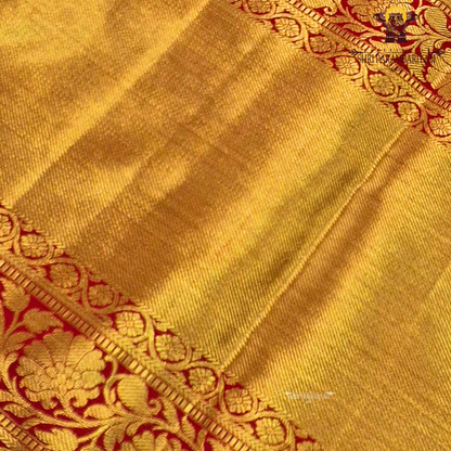 A vibrant combination of parrot green and rich gold Saree