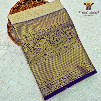 A regal combination of champagne gold and deep royal blue Saree
