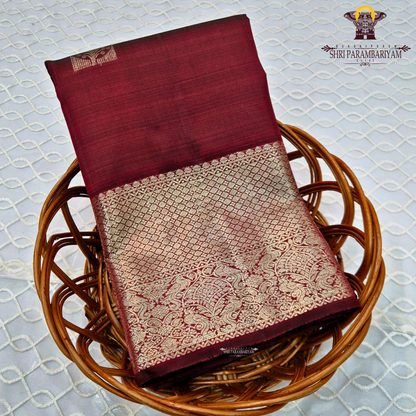 A rich dual-tone deep maroon with subtle wine undertones Saree