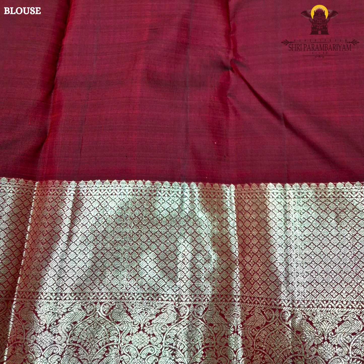 A rich dual-tone deep maroon with subtle wine undertones Saree