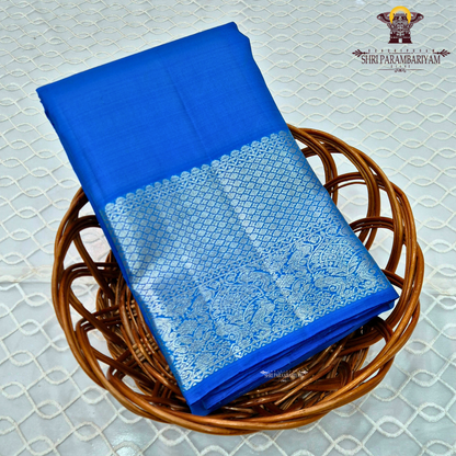 A vibrant royal blue with a smooth, luminous silk finish Saree
