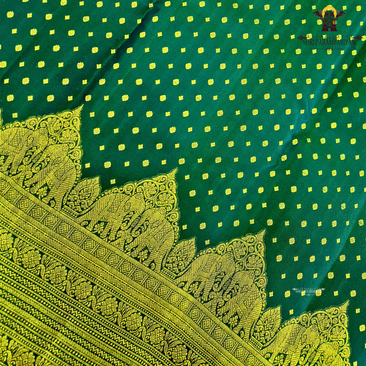 A classic Deep Green body adorned with finely woven gold zari Saree