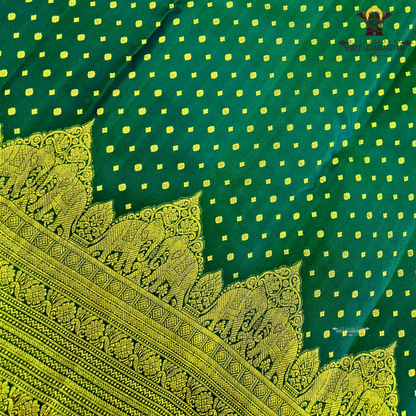 A classic Deep Green body adorned with finely woven gold zari Saree