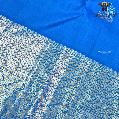 A vibrant royal blue with a smooth, luminous silk finish Saree