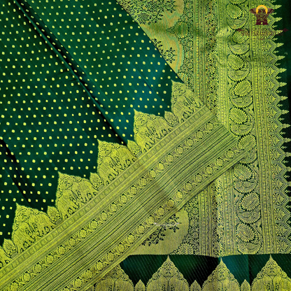 A classic Deep Green body adorned with finely woven gold zari Saree