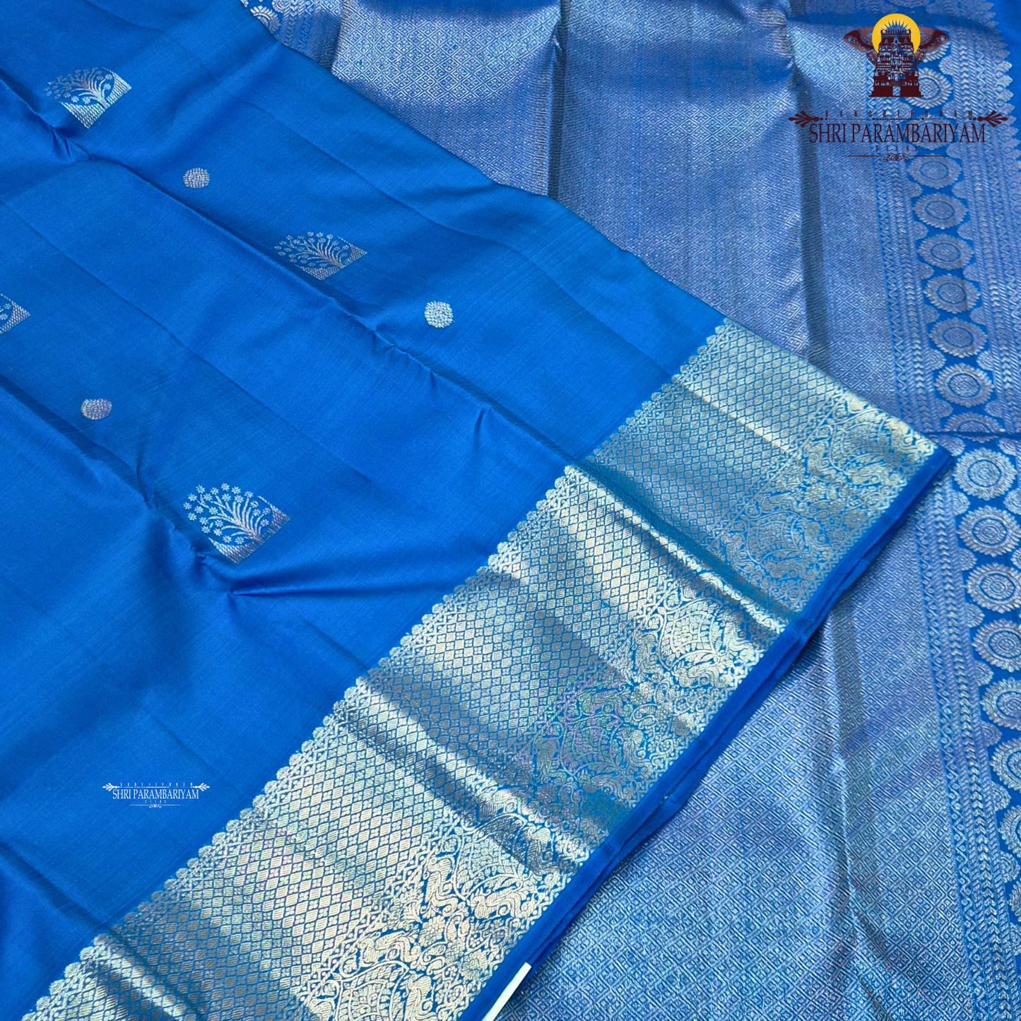A vibrant royal blue with a smooth, luminous silk finish Saree