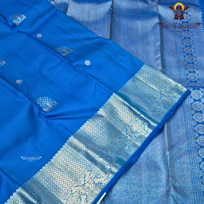 A vibrant royal blue with a smooth, luminous silk finish Saree