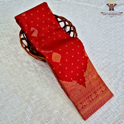 A rich Tomato Red / Vermilion Red body with elegant Golden Zari Saree