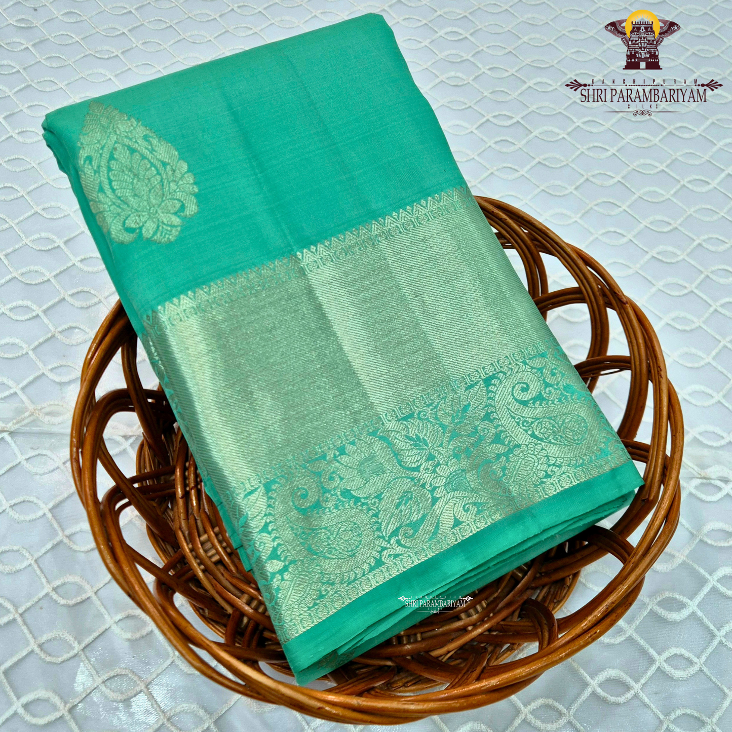 A refreshing sea green / aqua green shade with a soft, elegant silk sheen Saree
