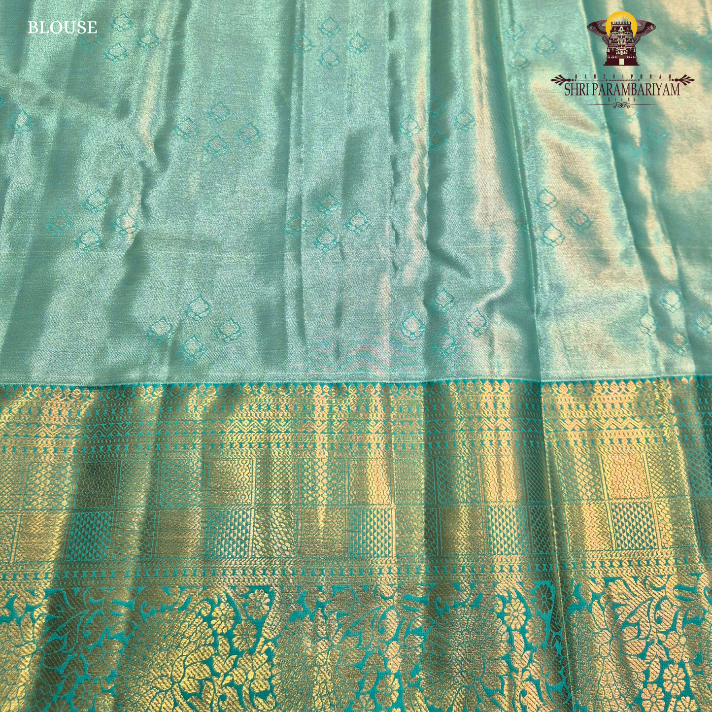A warm rust orange / copper brown Tissue Saree
