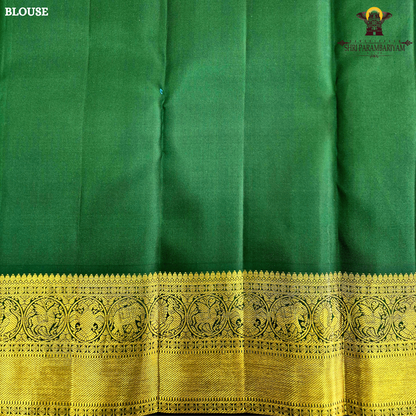 A vibrant mustard orange body highlighted with delicate zari buttas Saree