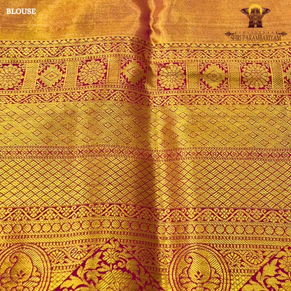 A soft ivory / off-white tissue base with rich antique gold zari work Saree