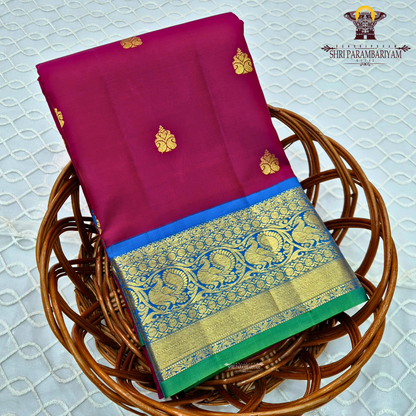 Deep Rani Pink / Maroonish Pink body with Royal Blue border and Green edge Saree