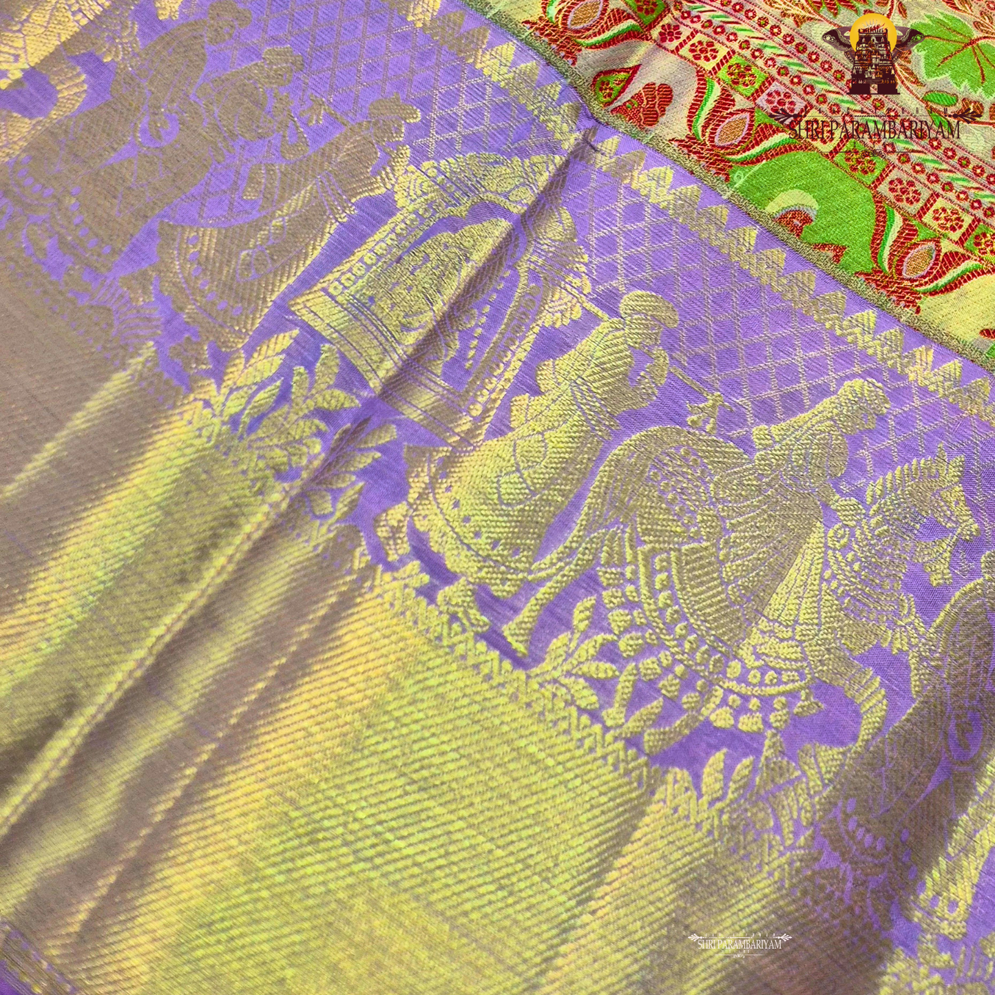 A charming lavender / lilac base paired with a rich golden zari pallu Saree