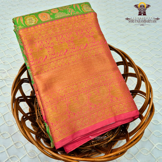 A vibrant rani pink tissue body paired with a contrasting parrot green border Saree
