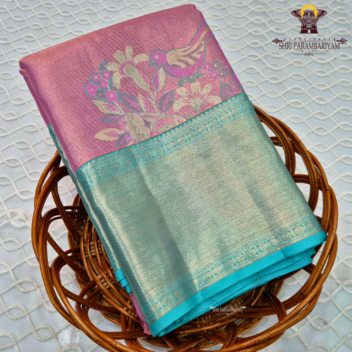 A graceful combination of rose pink body with a contrasting aqua green Saree