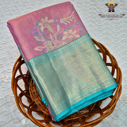 A graceful combination of rose pink body with a contrasting aqua green Saree