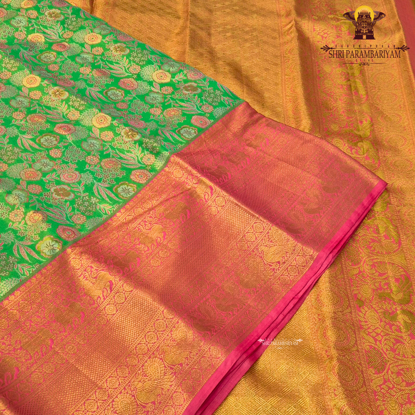 A vibrant rani pink tissue body paired with a contrasting parrot green border Saree