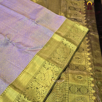 A beautiful pastel lavender (light purple with a rich antique gold zari border Saree