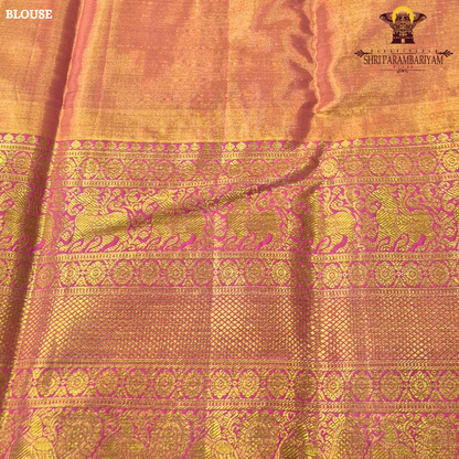 A vibrant rani pink tissue body paired with a contrasting parrot green border Saree
