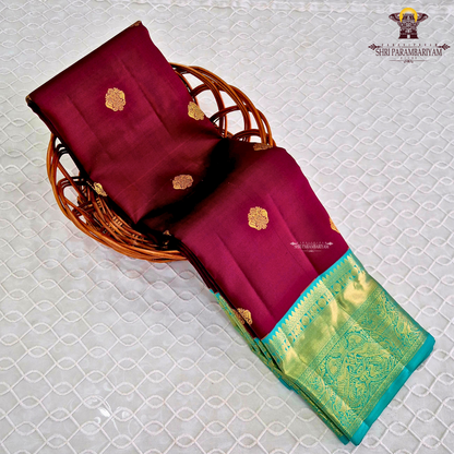 A rich Wine Magenta / Deep Rani Pink body with a contrasting Turquoise Blue Korvai Border Saree