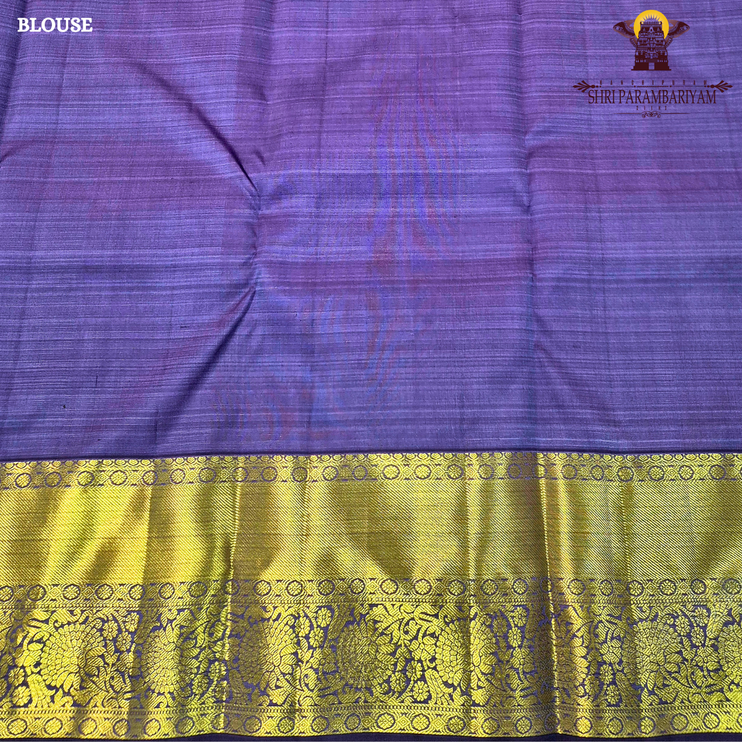 A rich Sky blue with a rich gold zari border and a contrasting royal purple edging Saree