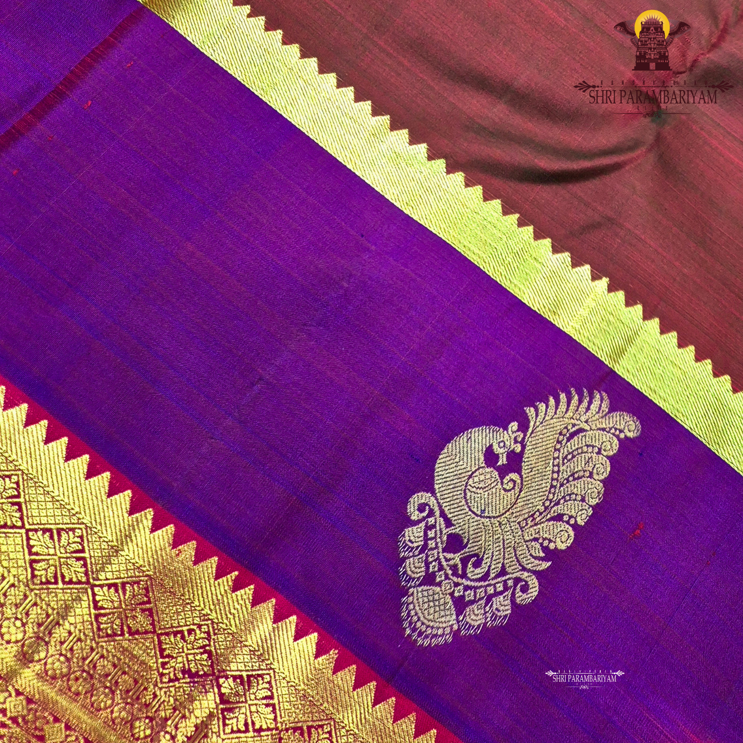 A classic tri-tone rusty maroon, royal purple, and deep pink (rani) Saree