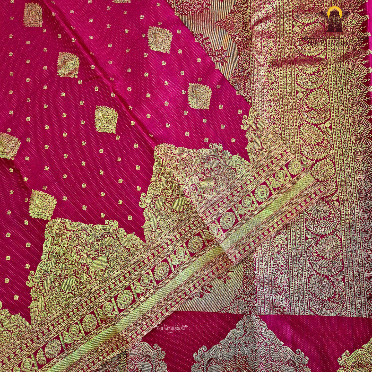 A rich Tomato Red / Vermilion Red body with elegant Golden Zari Saree