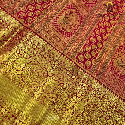 Bright vermilion red with rich antique gold zari accents Saree