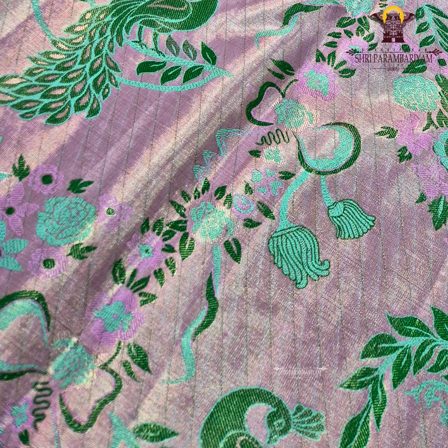 Soft pastel lavender-pink base with contrasting Saree