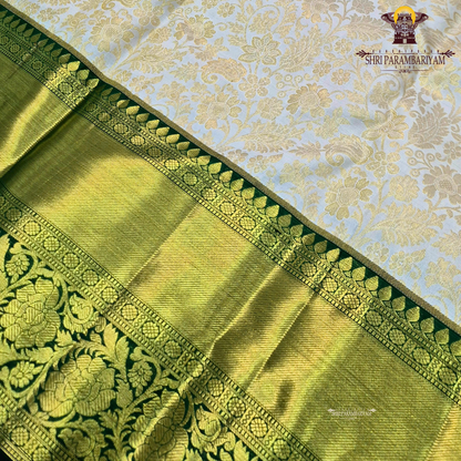 Soft half white (ivory/off-white) body with bottle green contrast border Saree