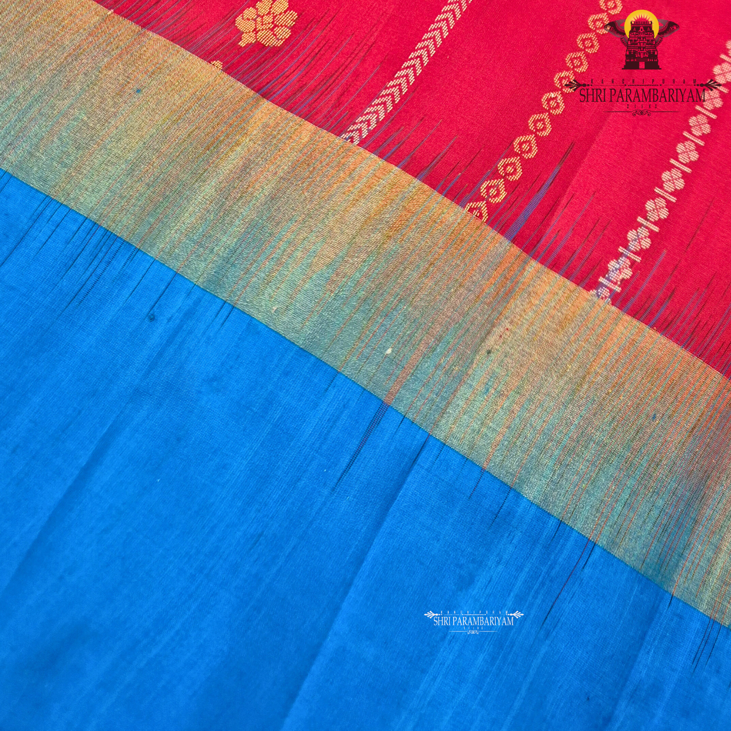A vibrant deep red body paired with a contrasting Saree