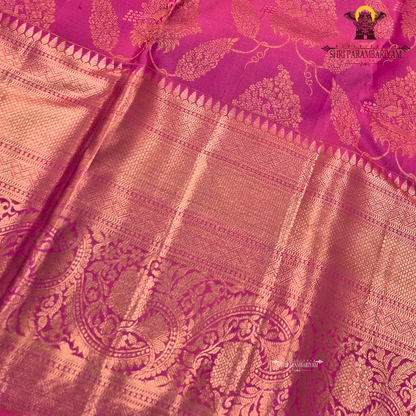 A bright and rich deep pink (rani pink) with radiant gold zari work Saree